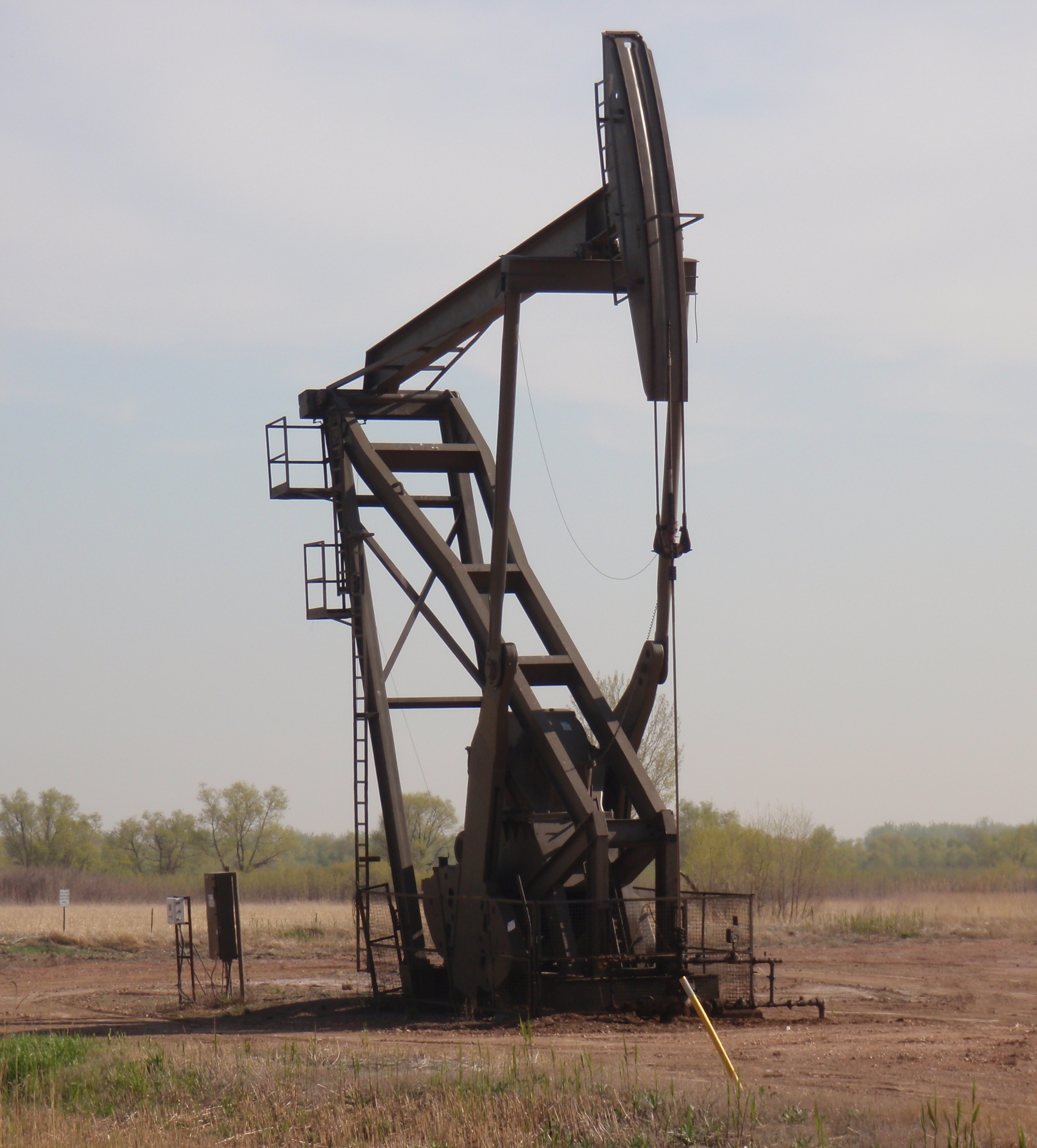 Lonely pump jack in field along side road to shooting range south of Williston. May 2015 photo by James Ulvog.